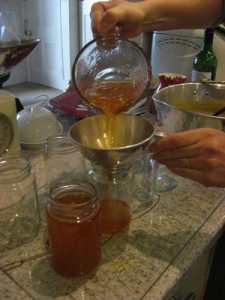 Pouring the cooled marmalade into jars